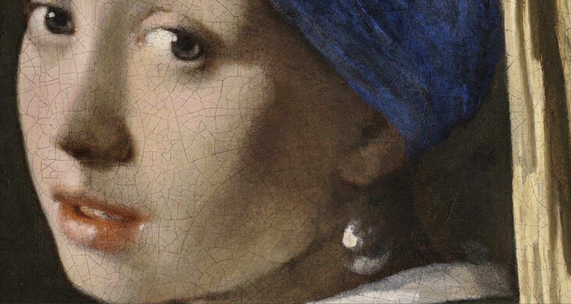 a detail of the face of Johannes Vermeer's 'Girl With a Pearl Earring'